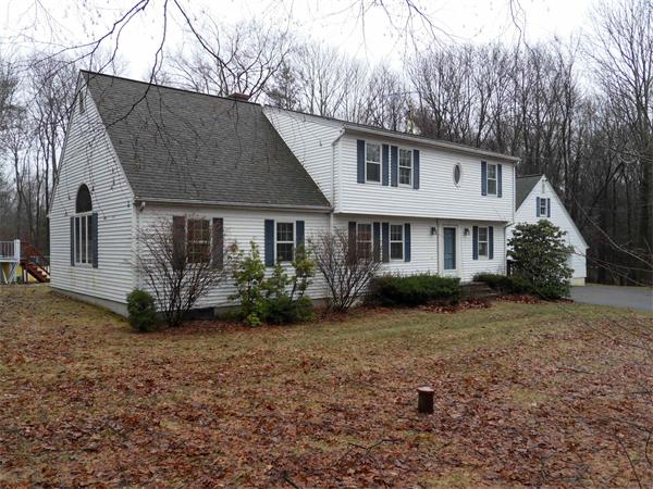 63 Purgatory Road Sutton, MA 01590 - Photo 4 of 22 a view of a house with yard and a garden
