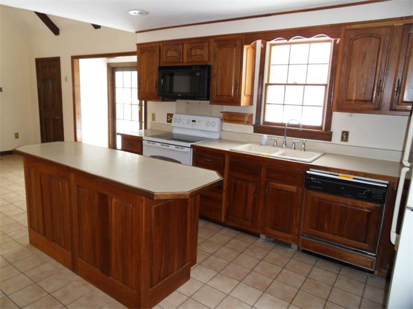 63 Purgatory Road Sutton, MA 01590 - Photo 5 of 22 a kitchen with a sink stove and microwave