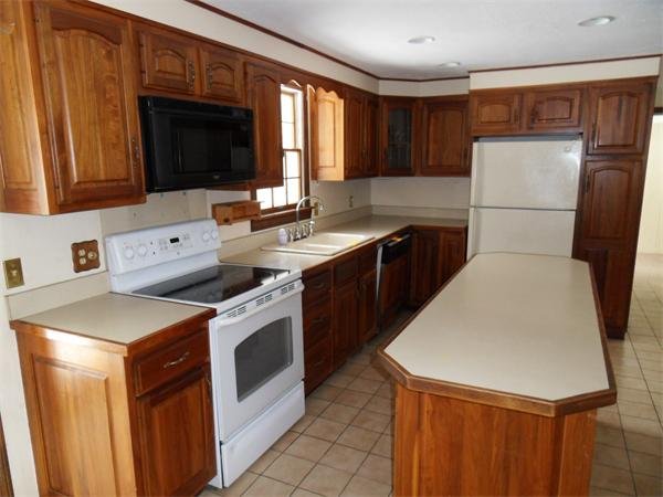 63 Purgatory Road Sutton, MA 01590 - Photo 6 of 22 a kitchen with a sink a stove top oven a refrigerator and a microwave