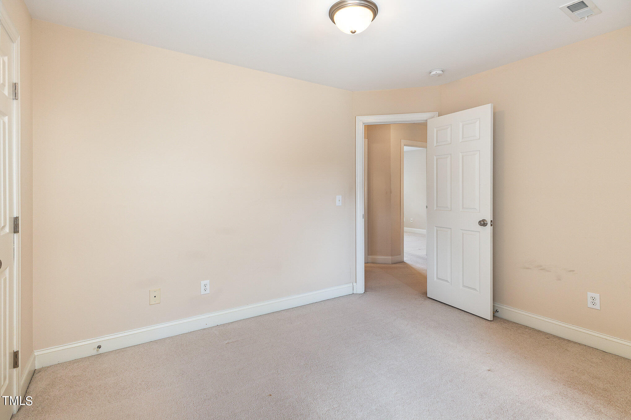 2809 Oak Bridge Drive Raleigh, NC 27610 - Photo 22 of 37 an empty room with an entryway