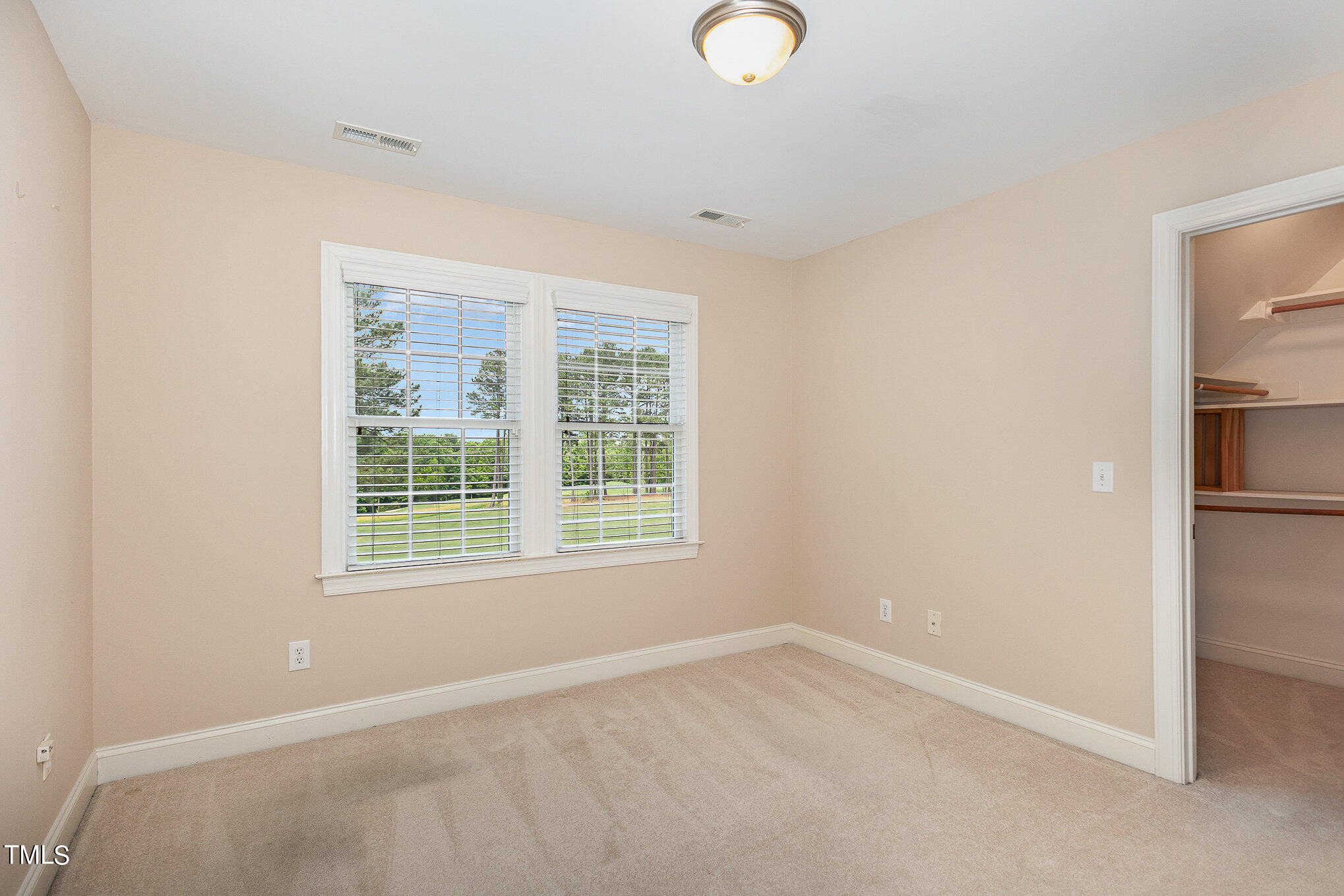 2809 Oak Bridge Drive Raleigh, NC 27610 - Photo 24 of 37 an empty room with a window