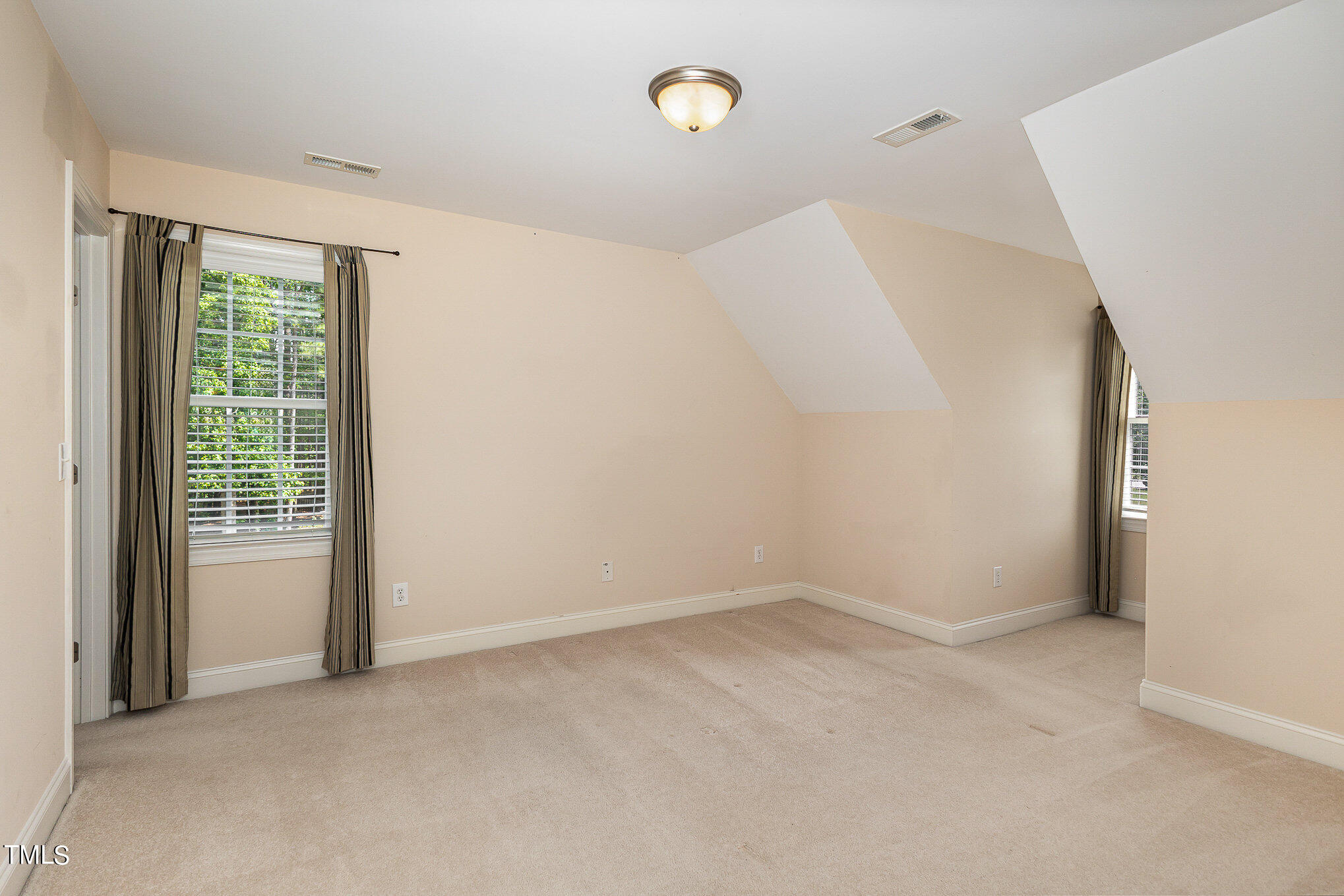 2809 Oak Bridge Drive Raleigh, NC 27610 - Photo 26 of 37 a view of an empty room with a window