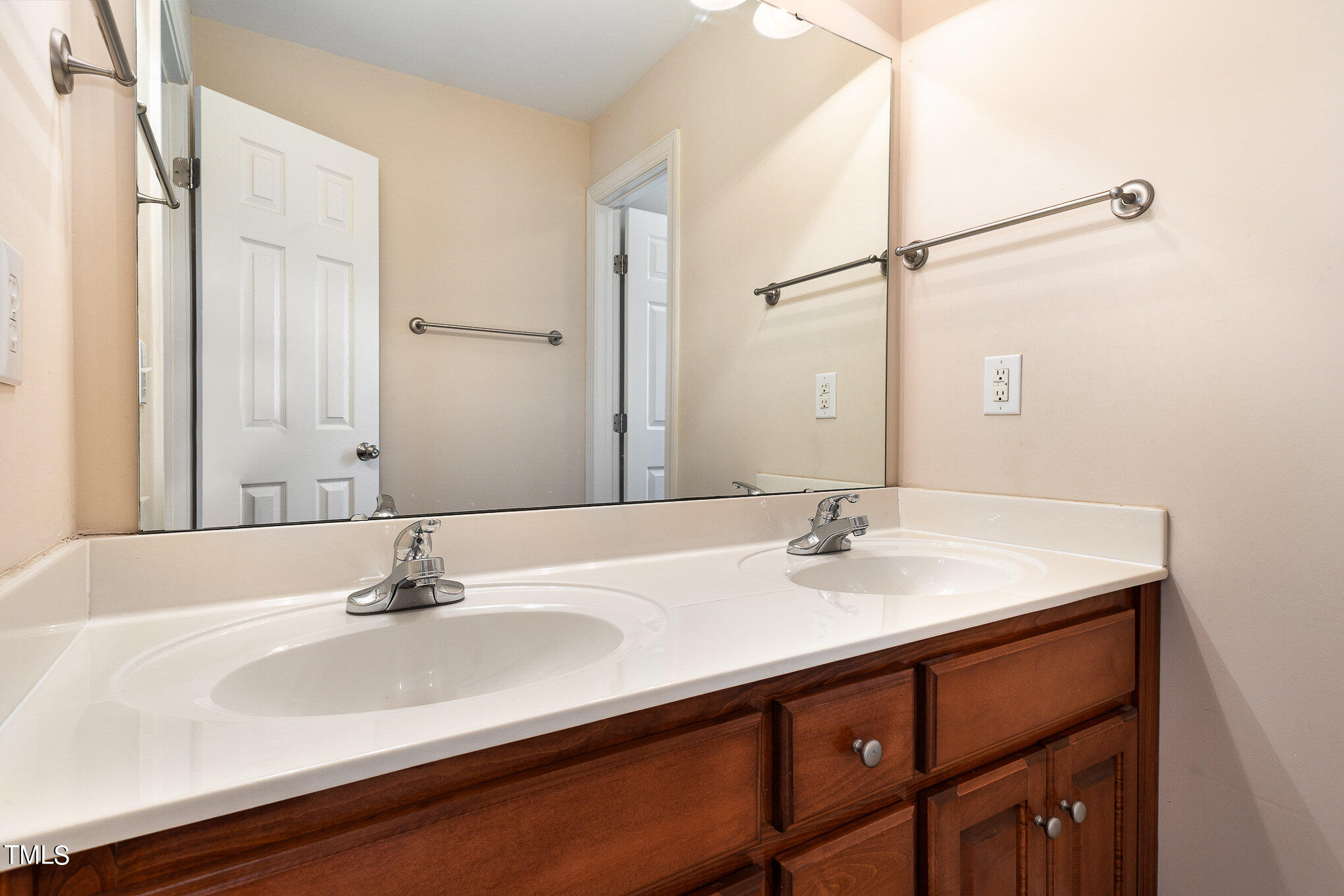 2809 Oak Bridge Drive Raleigh, NC 27610 - Photo 28 of 37 a bathroom with a sink and a mirror