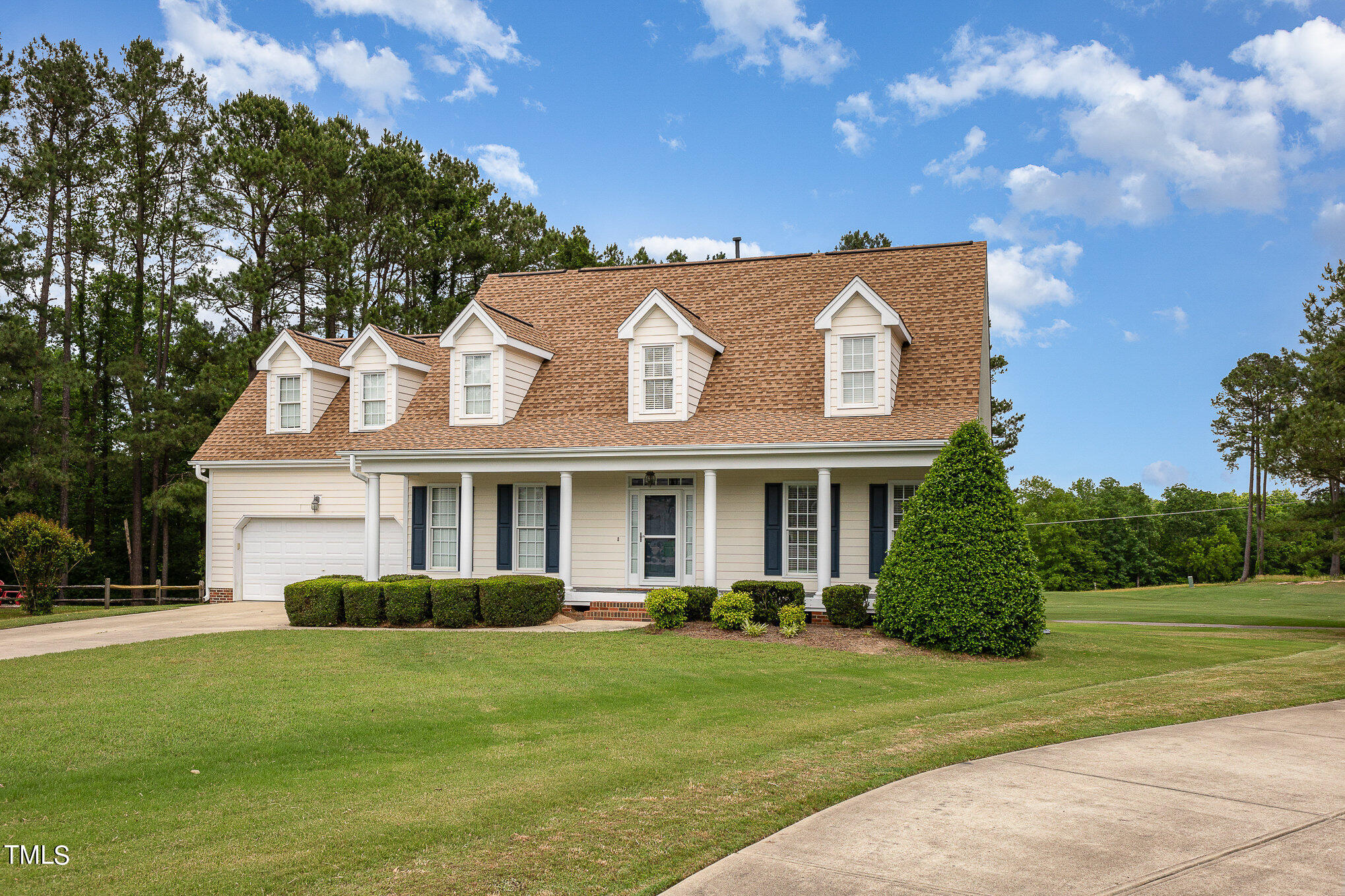 2809 Oak Bridge Drive Raleigh, NC 27610 - Photo 3 of 37 a front view of a house with a garden