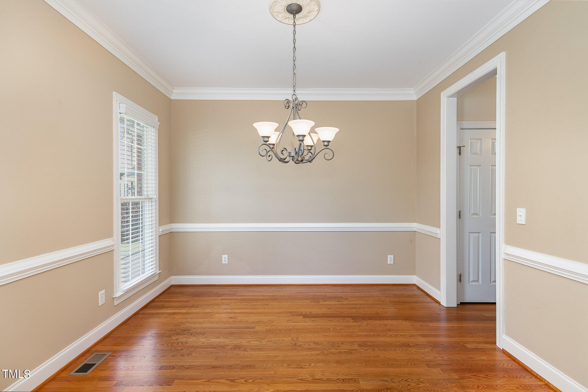2809 Oak Bridge Drive Raleigh, NC 27610 - Photo 8 of 37 a room with hard wood floors and a window