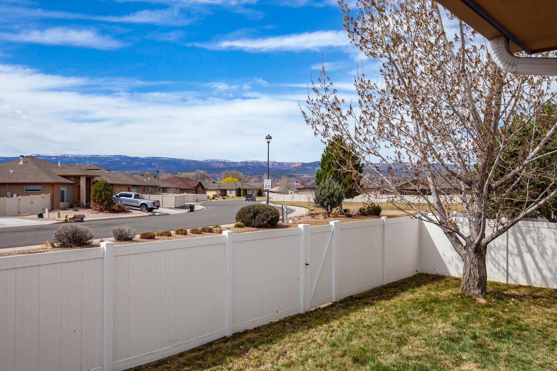 225 29 Road Grand Junction, CO 81503 - Photo 12 of 41 a view of a white house with a yard and sitting area