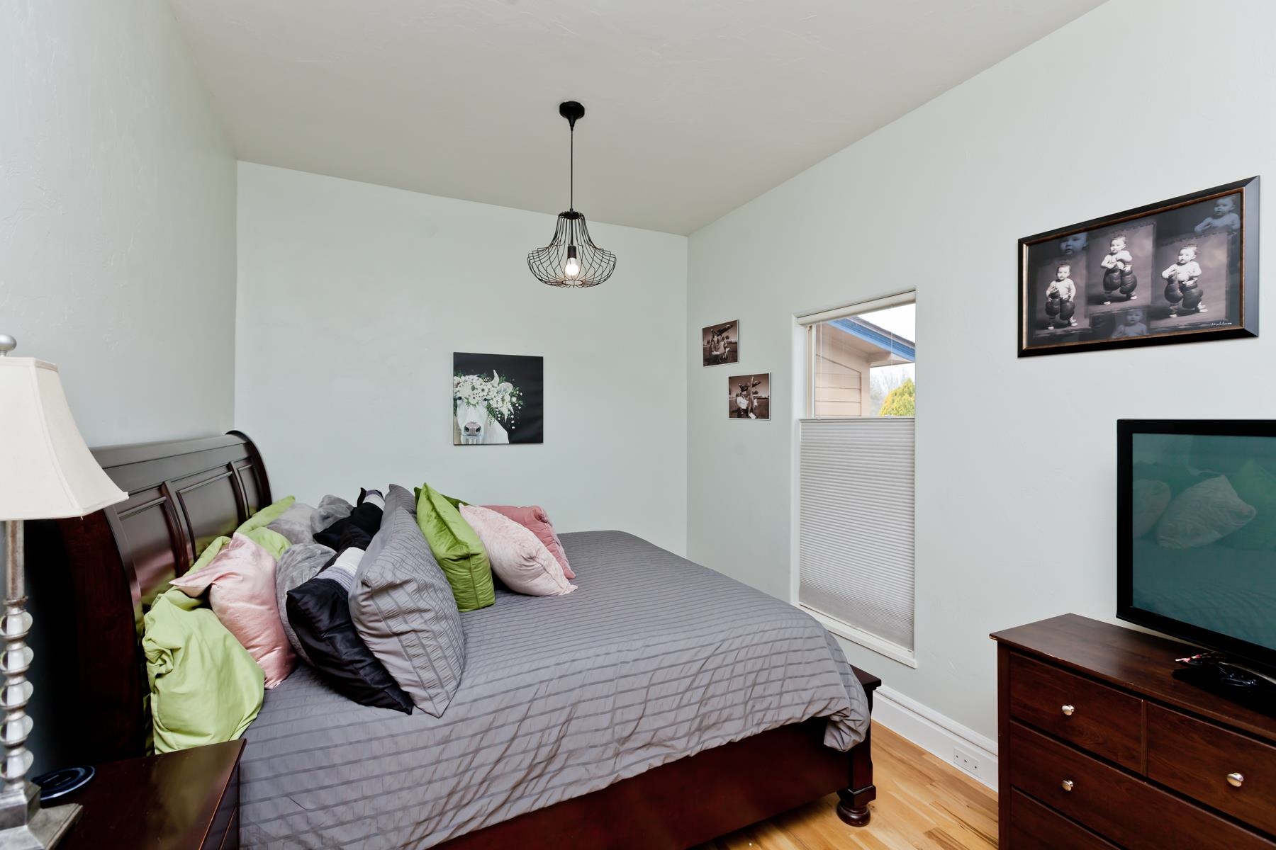 225 29 Road Grand Junction, CO 81503 - Photo 13 of 41 a bedroom with a bed and a flat screen television