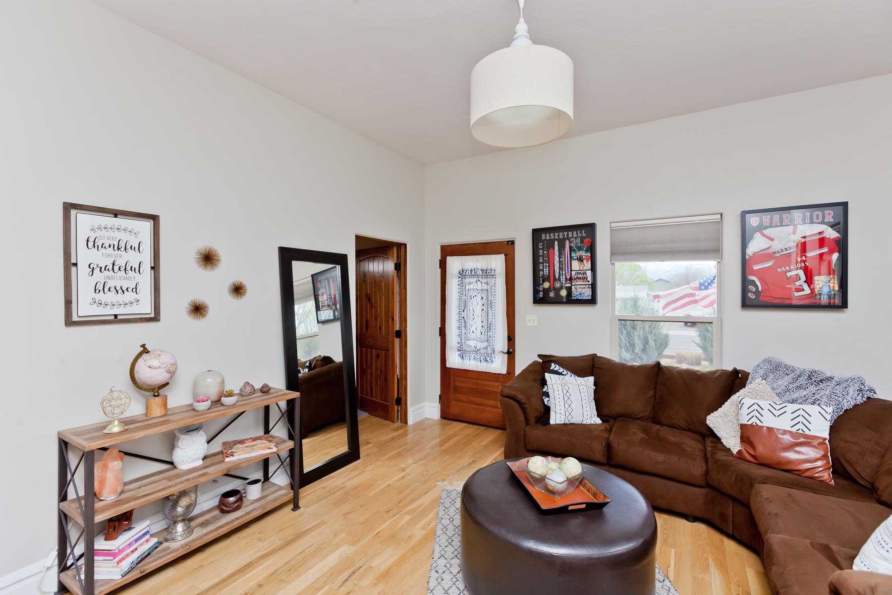 225 29 Road Grand Junction, CO 81503 - Photo 15 of 41 a living room with furniture and a chandelier