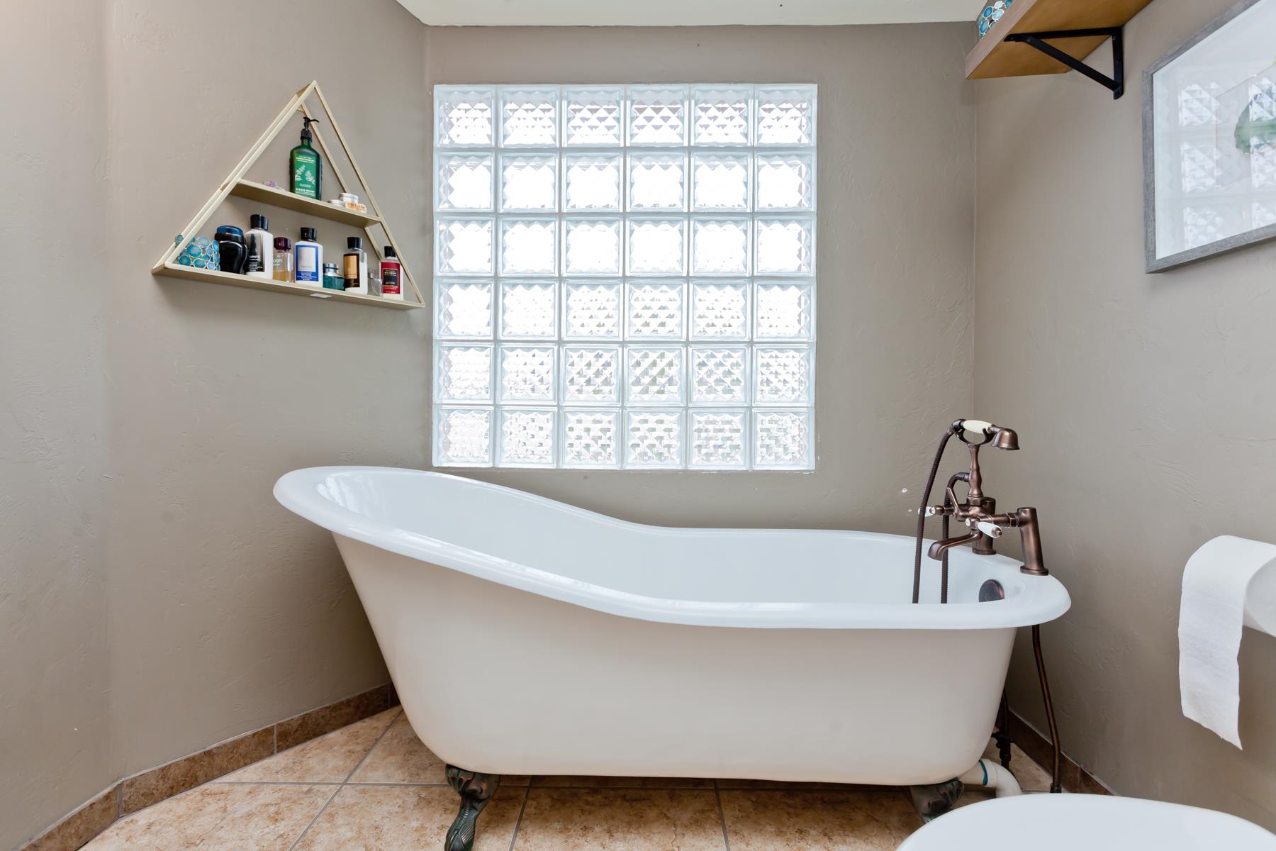 225 29 Road Grand Junction, CO 81503 - Photo 28 of 41 a white bath tub sitting in a bathroom next to a window