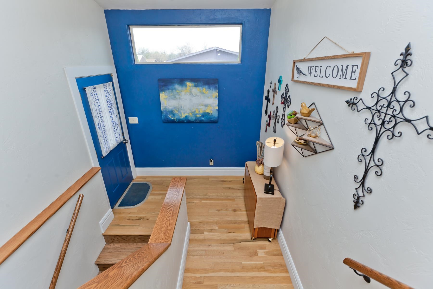 225 29 Road Grand Junction, CO 81503 - Photo 29 of 41 a view of hallway with stairs and wooden floor