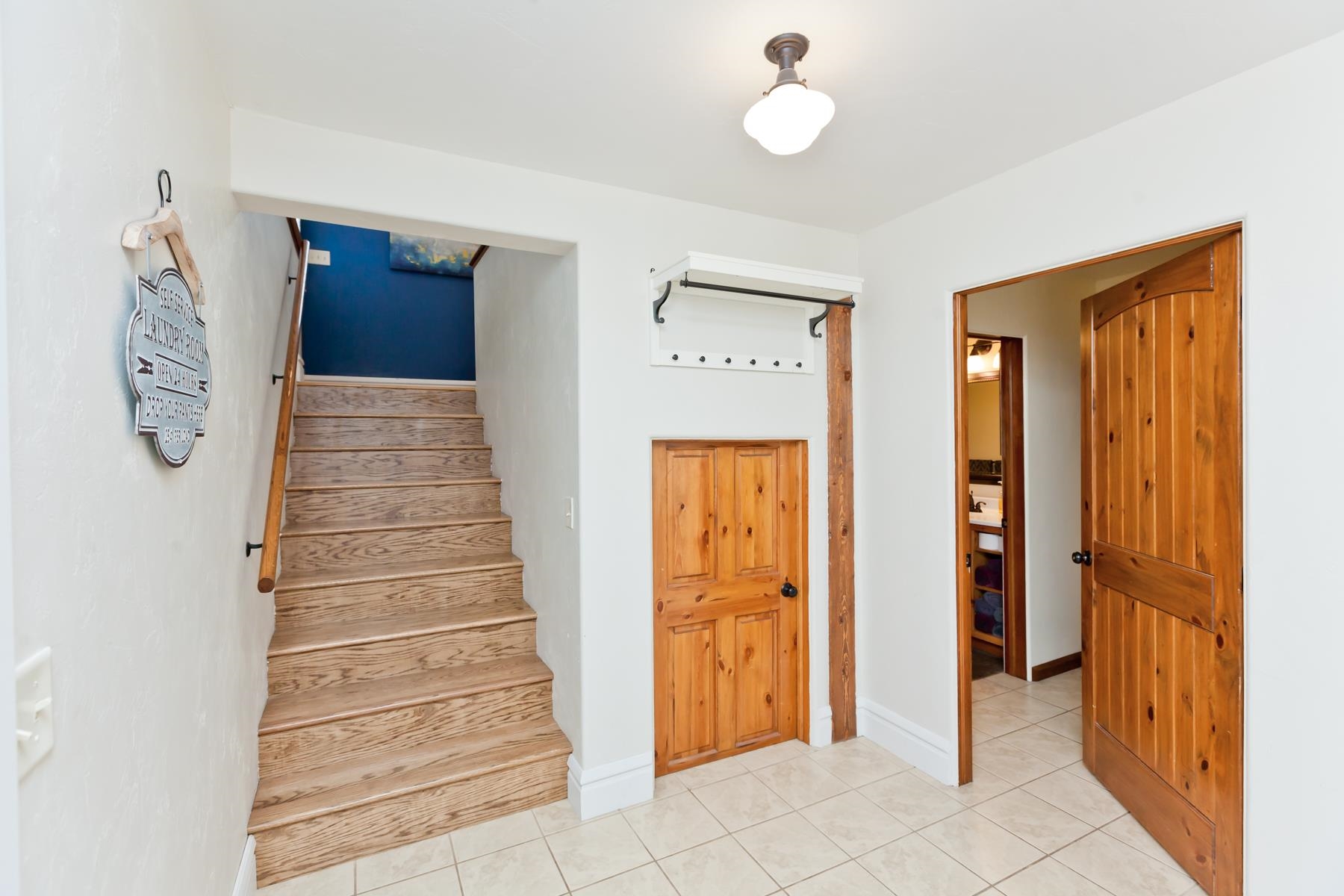 225 29 Road Grand Junction, CO 81503 - Photo 34 of 41 a view of a hallway with entryway wooden floor and front door