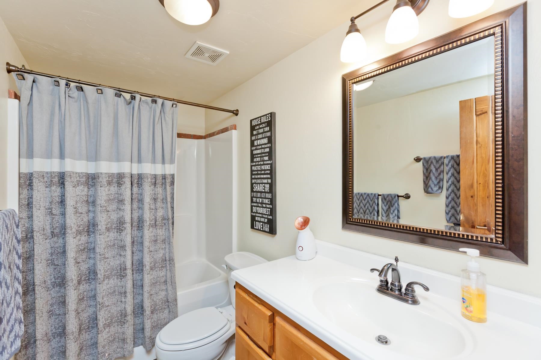 225 29 Road Grand Junction, CO 81503 - Photo 36 of 41 a bathroom with a sink vanity mirror and toilet