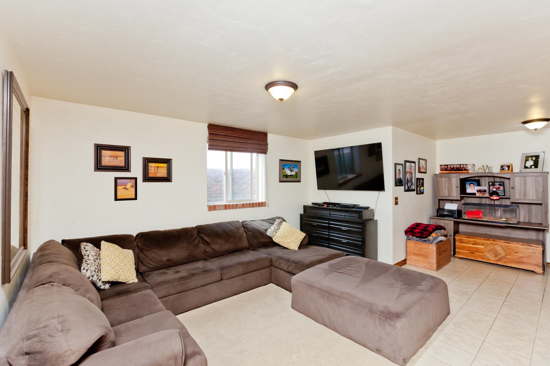 225 29 Road Grand Junction, CO 81503 - Photo 40 of 41 a living room with furniture and a flat screen tv