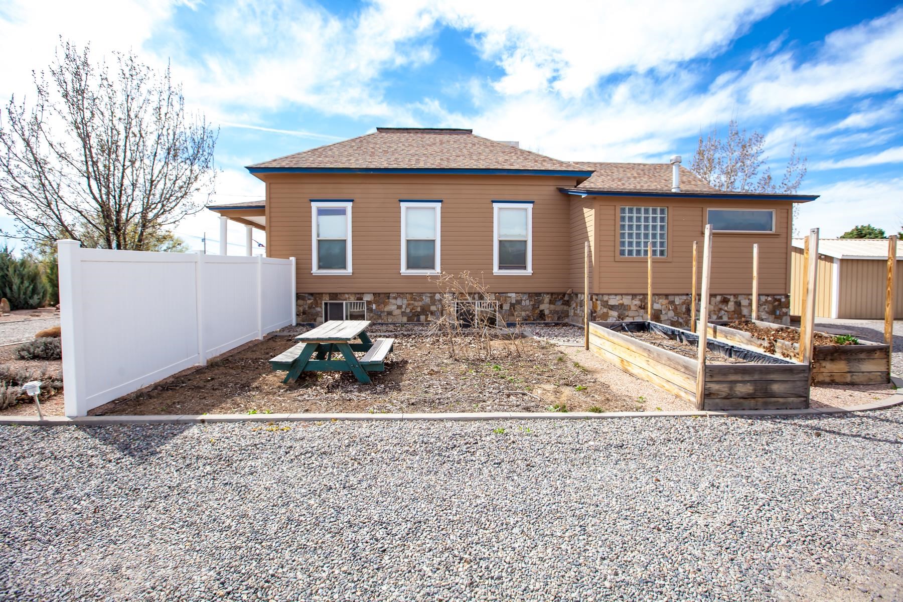 225 29 Road Grand Junction, CO 81503 - Photo 4 of 41 a front view of a house with a yard