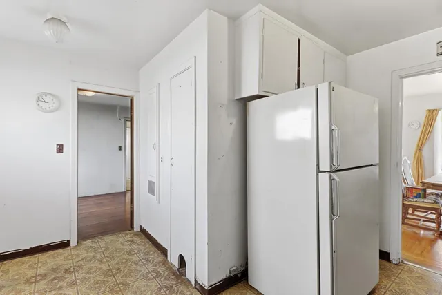 a view of a livingroom with wooden floor and furniture