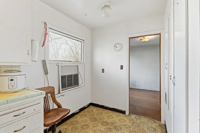 an empty room with wooden floor