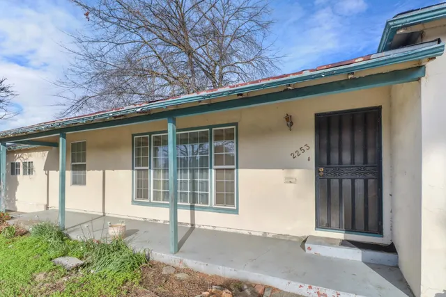 front view of a house with a small yard
