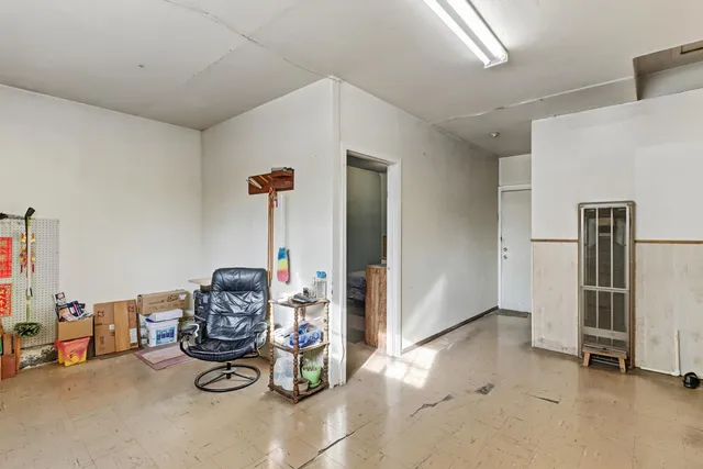 a room with a bed and a desk