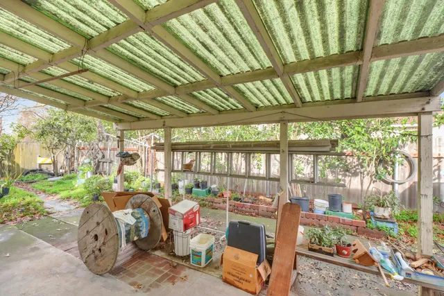 an aerial view of residential building with green space