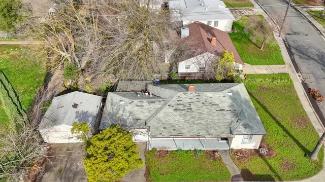 an aerial view of residential houses with outdoor space