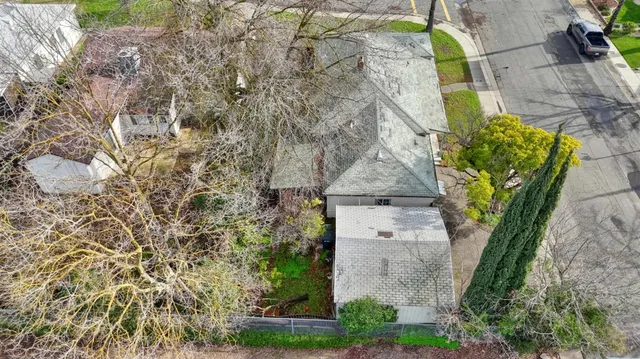 an aerial view of residential houses with city view