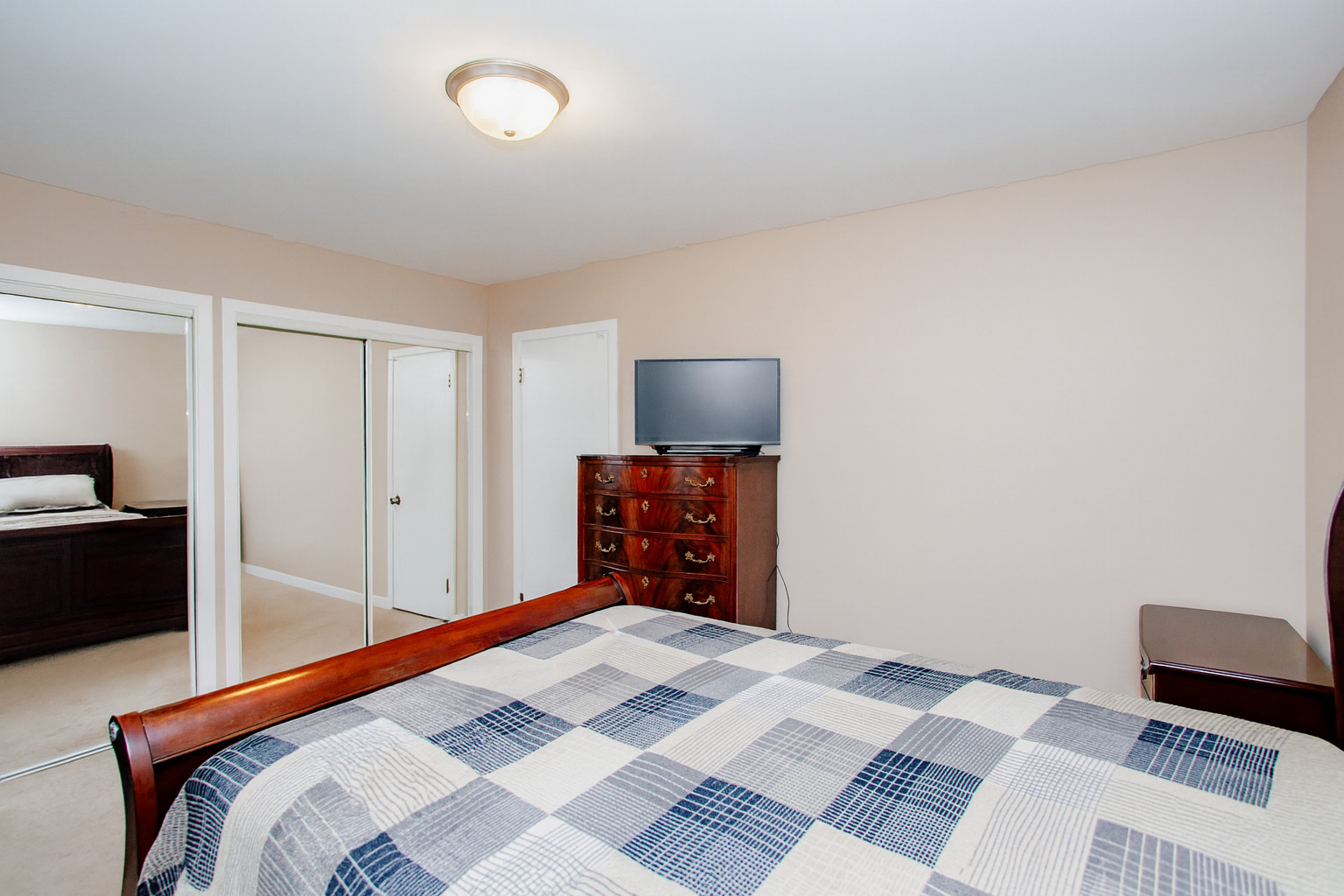 311 Vine Avenue, Unit E Park Ridge, IL 60068 - Photo 14 of 21 a bedroom with a bed and a television