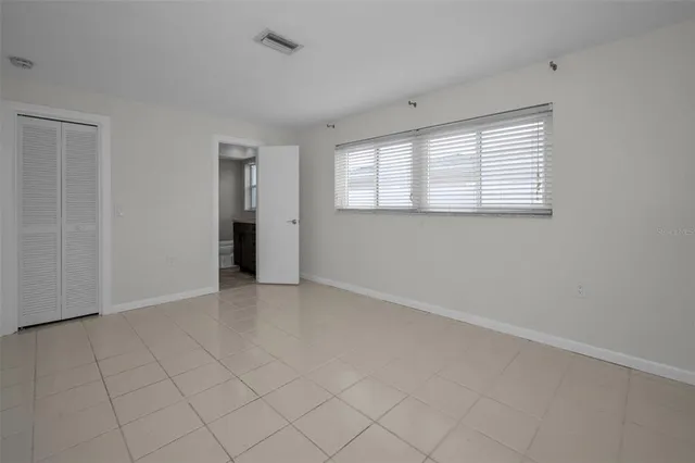 a view of room with window and ceiling fan