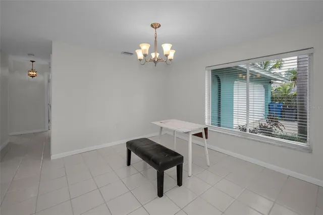 a kitchen with granite countertop wooden cabinets and stainless steel appliances