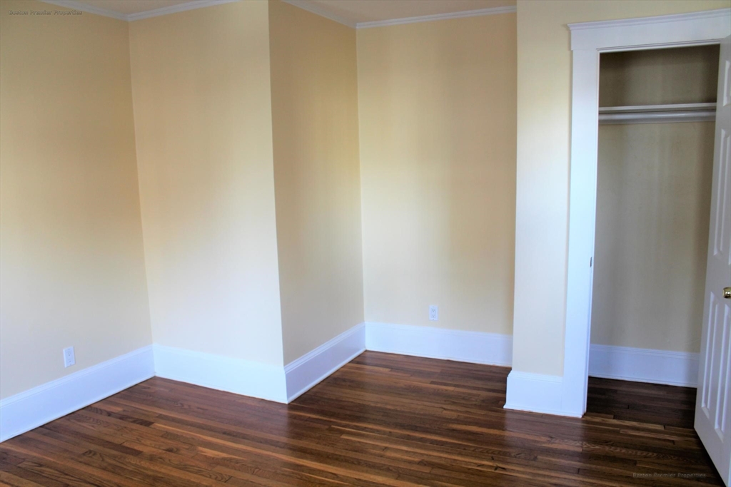 14 Ginita Street, Unit 1 Boston, MA 02122 - Photo 6 of 12 a view of empty room with wooden floor