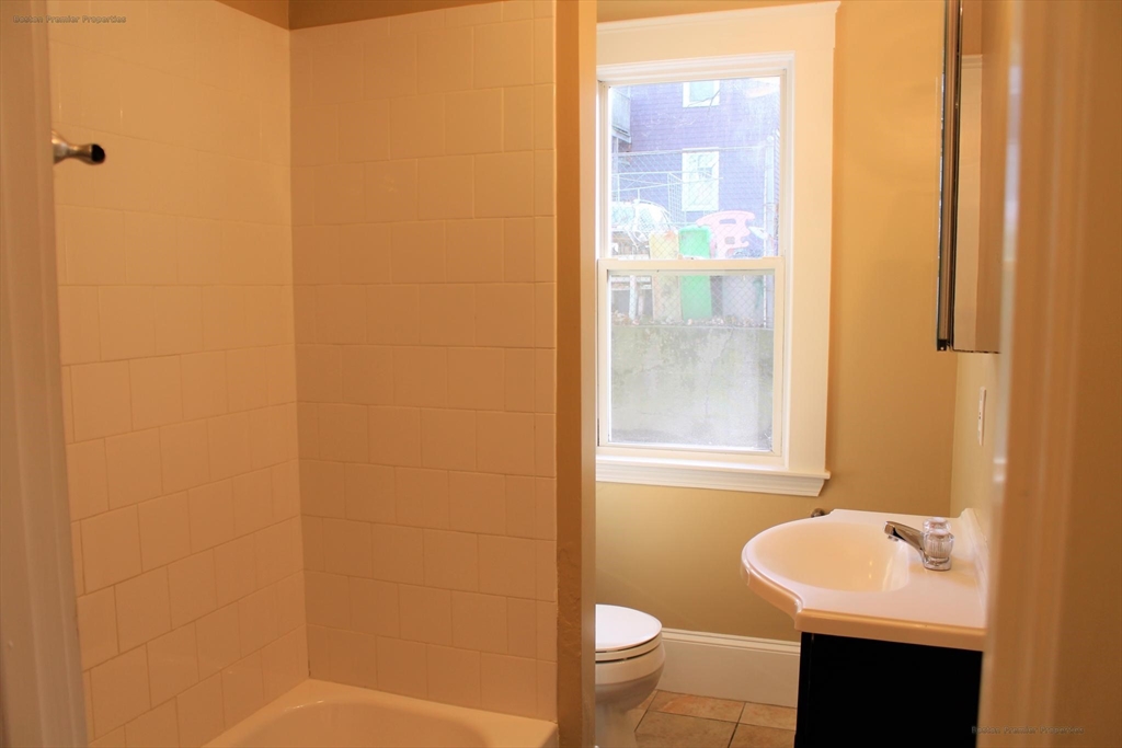 14 Ginita Street, Unit 1 Boston, MA 02122 - Photo 7 of 12 a bathroom with a sink and a mirror