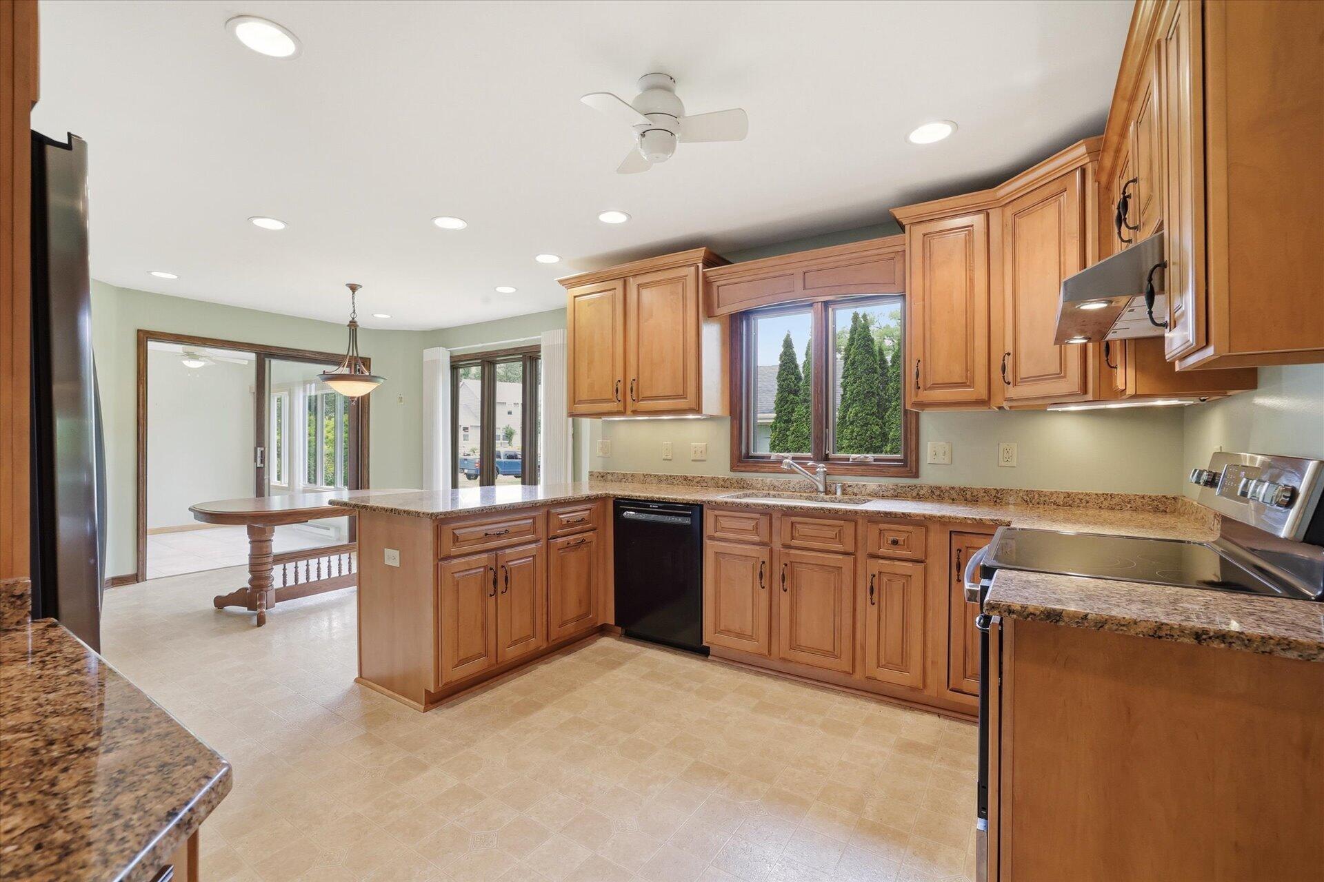 4100 South 119th Street Greenfield, WI 53228 - Photo 5 of 31 Kitchen open to dinette and four season room. Laundry room also off of the kitchen!