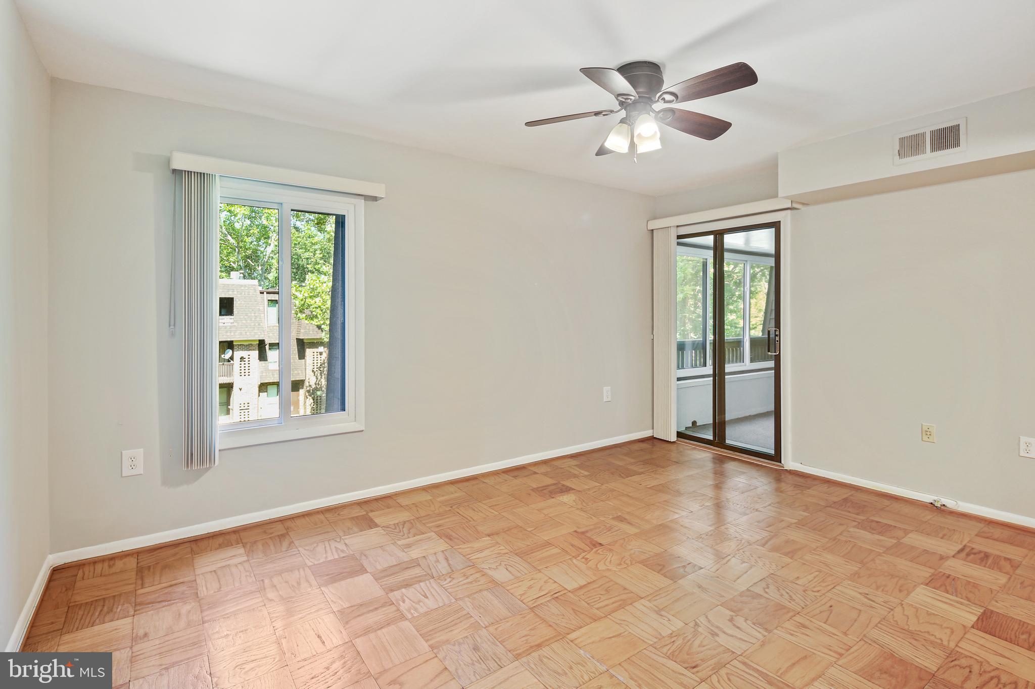 5239 West Running Brook Road, Unit 301 Columbia, MD 21044 - Photo 25 of 33 an empty room with fan and windows