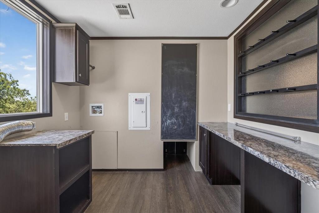 1129 Ragsdale Street Terrell, TX 75160 - Photo 11 of 29 Nice sized utility room with storage and room to fold your clothes and extra storage