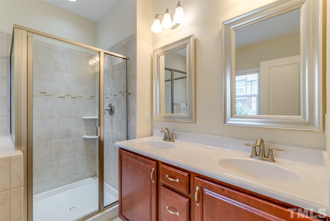 1564 Rodessa Run Raleigh, NC 27607 - Photo 15 of 25 a bathroom with a sink and a mirror