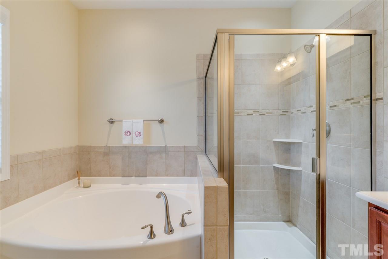 1564 Rodessa Run Raleigh, NC 27607 - Photo 16 of 25 a bathroom with a tub and shower