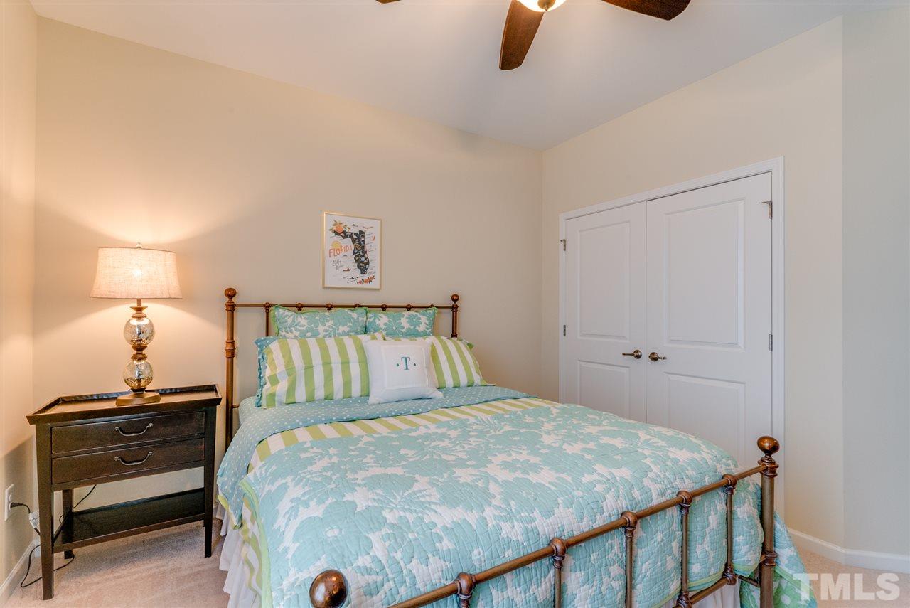 1564 Rodessa Run Raleigh, NC 27607 - Photo 21 of 25 a bedroom with a bed and a window