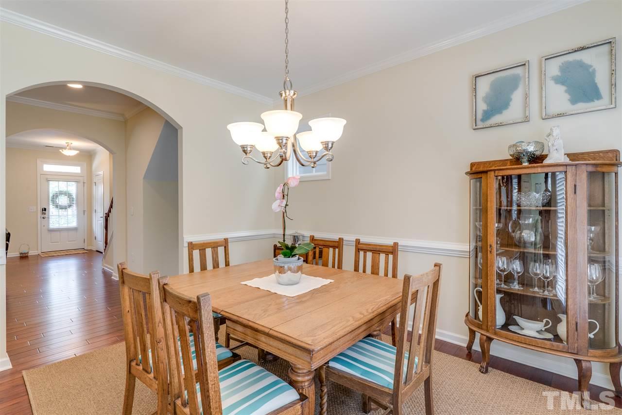 1564 Rodessa Run Raleigh, NC 27607 - Photo 5 of 25 a view of a dining room with furniture and wooden floor
