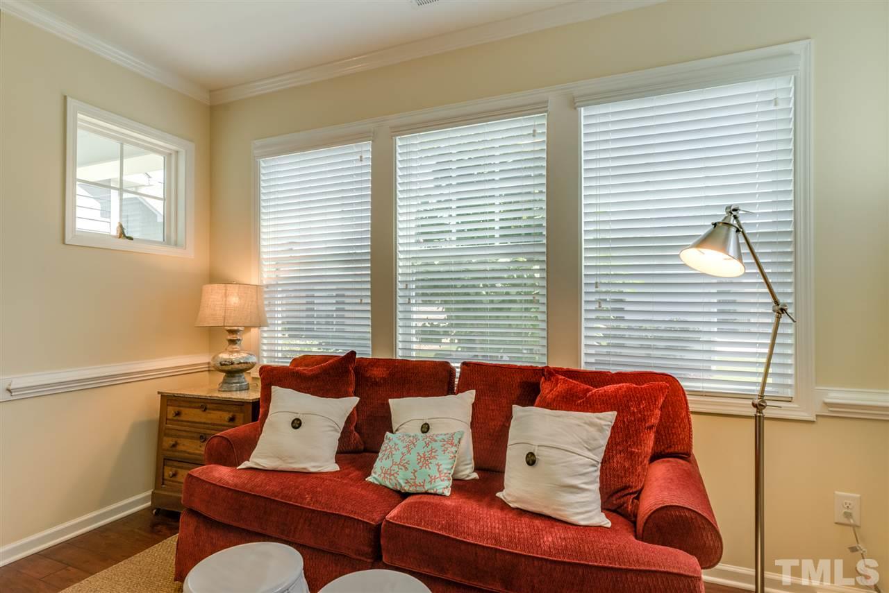 1564 Rodessa Run Raleigh, NC 27607 - Photo 8 of 25 a bedroom with furniture and a window