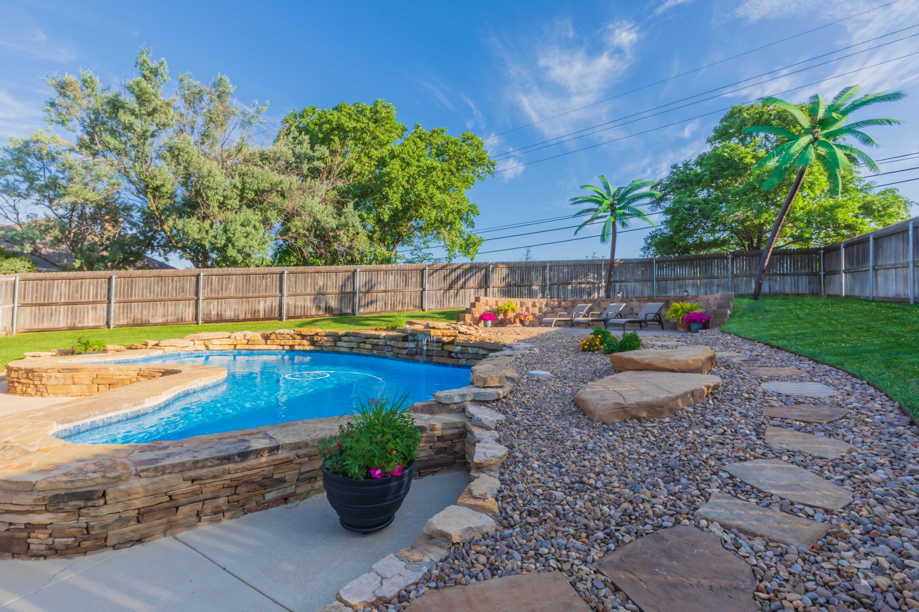 2308 Madera Place Amarillo, TX 79124 - Photo 1 of 61 a view of a swimming pool with a lounge chair and swimming pool