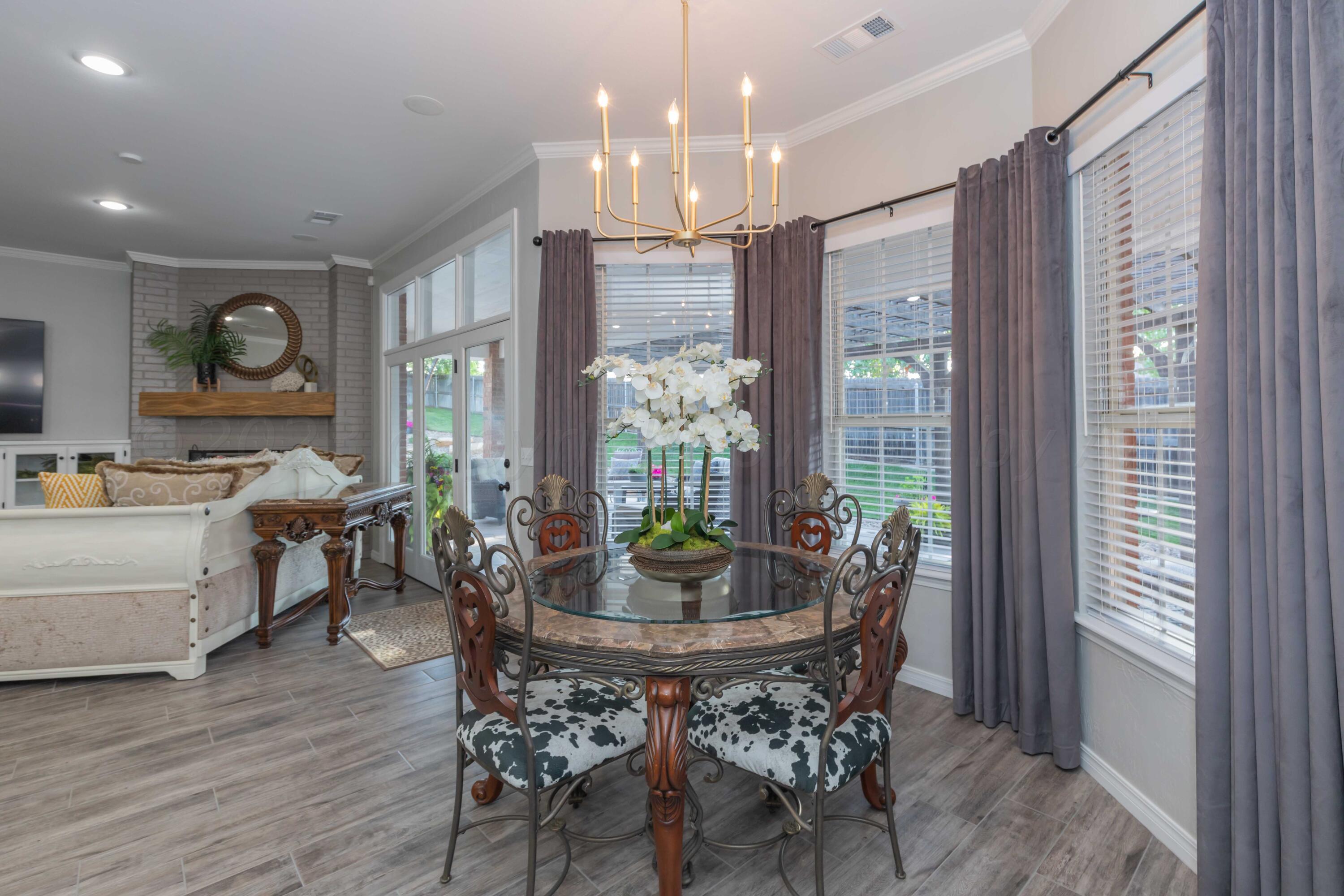 2308 Madera Place Amarillo, TX 79124 - Photo 13 of 61 a view of a dining room with furniture window and wooden floor