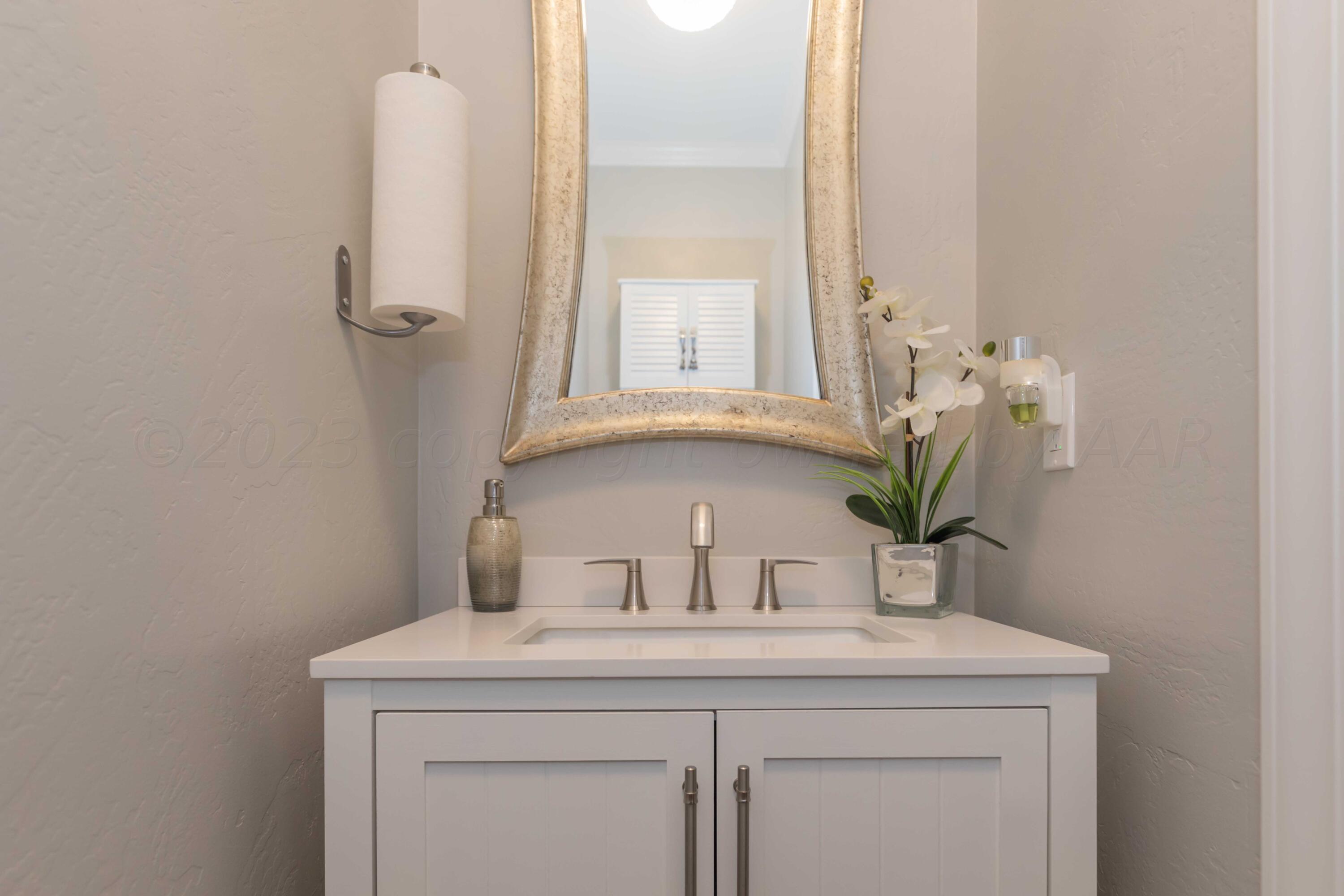 2308 Madera Place Amarillo, TX 79124 - Photo 22 of 61 a bathroom with a sink a vanity and a mirror