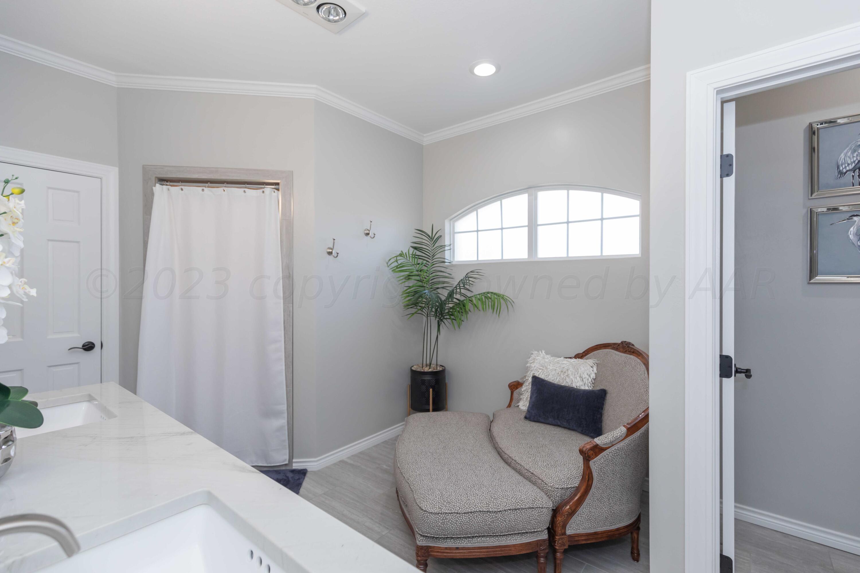 2308 Madera Place Amarillo, TX 79124 - Photo 35 of 61 a bedroom with a bed and a potted plant
