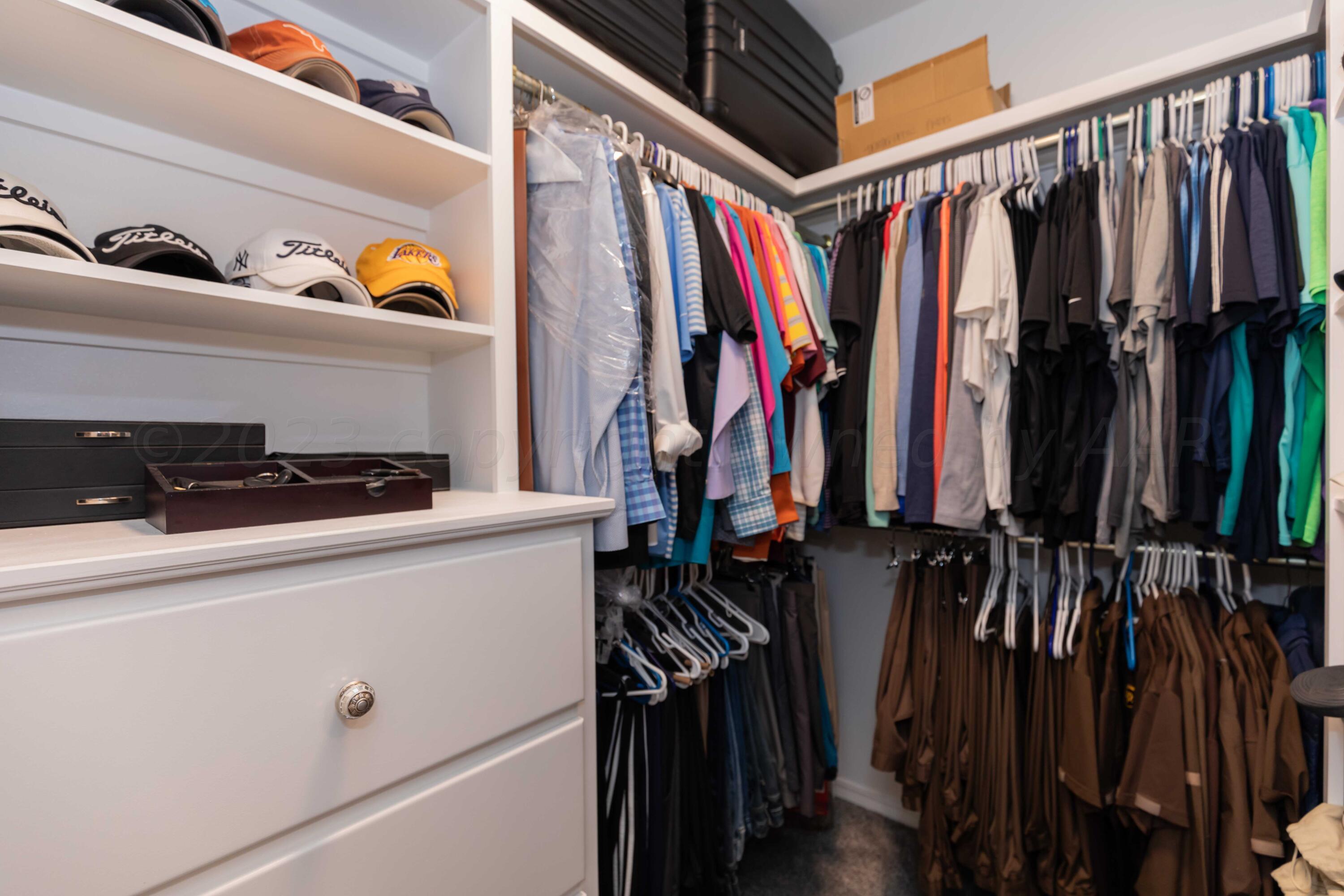 2308 Madera Place Amarillo, TX 79124 - Photo 40 of 61 a view of walk in closet with clothes and shoes