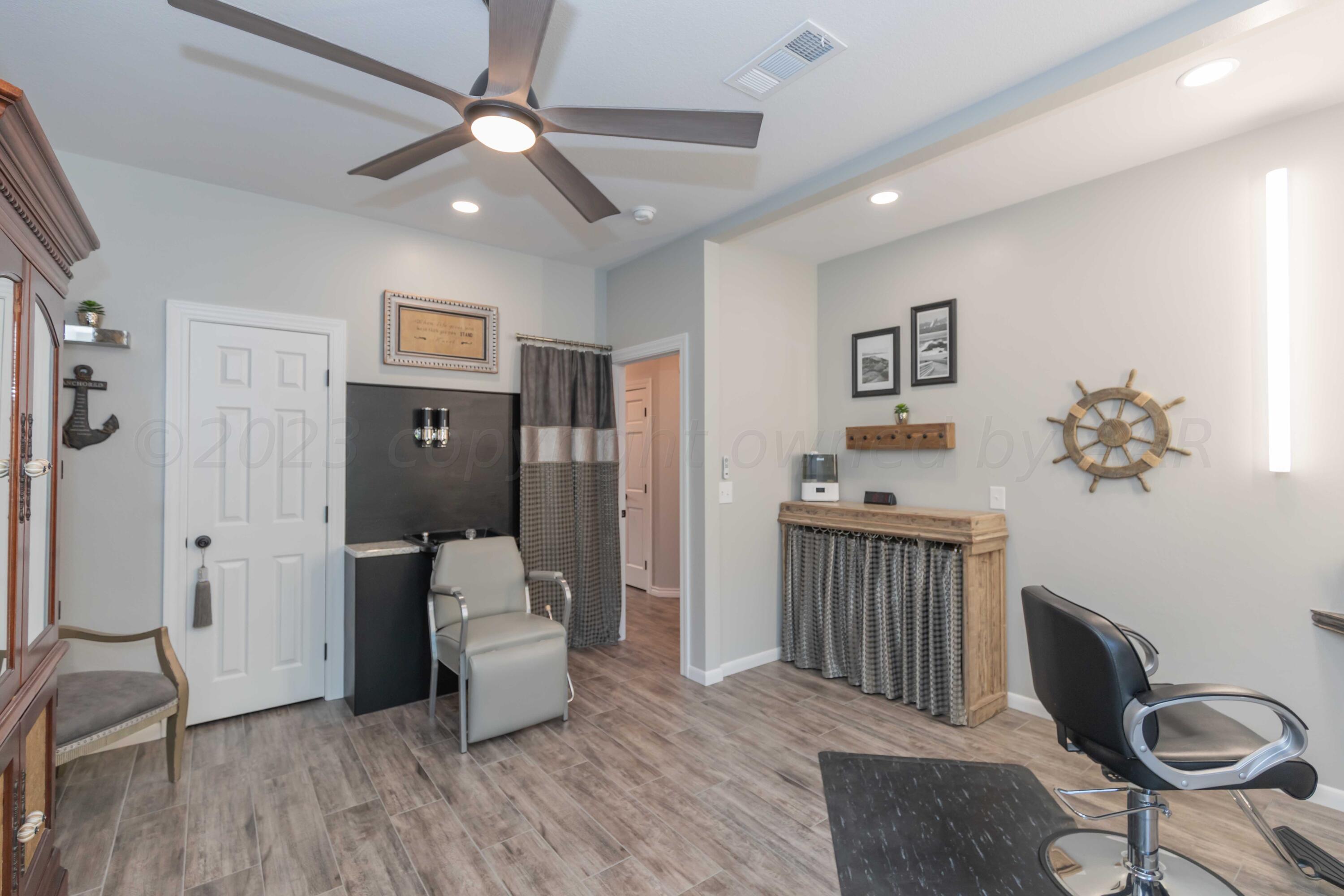 2308 Madera Place Amarillo, TX 79124 - Photo 49 of 61 a room with furniture and wooden floor