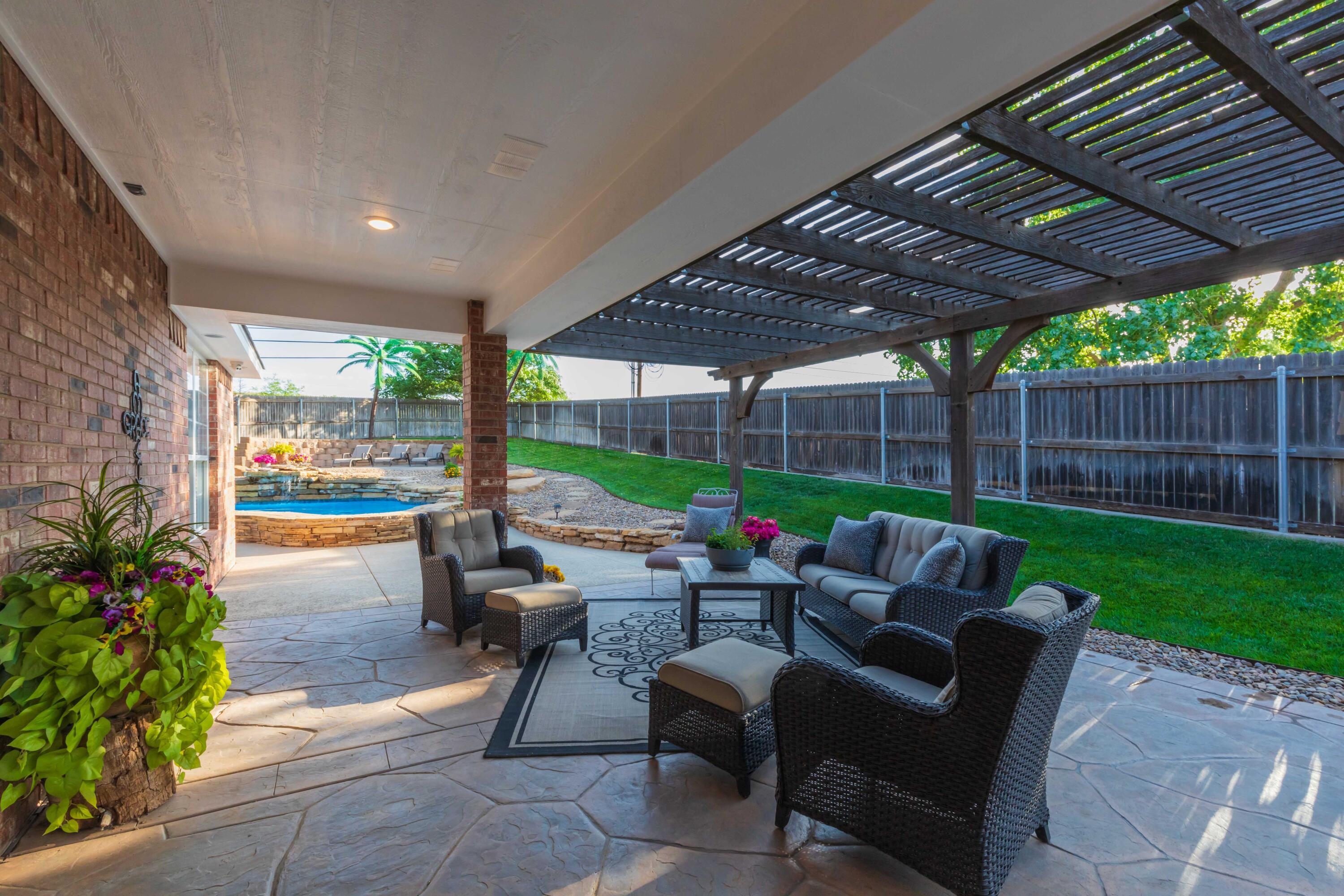 2308 Madera Place Amarillo, TX 79124 - Photo 61 of 61 a building outdoor space with patio furniture and potted plants