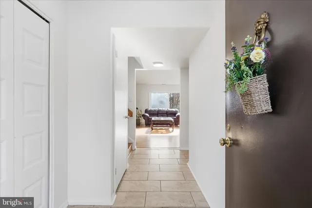 a living room with furniture wooden floor and a flat screen tv