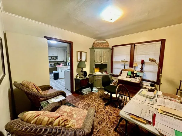 a bedroom with furniture or couch and a large window