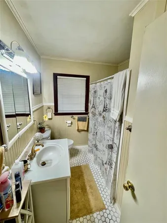 a bathroom with a sink vanity and a mirror