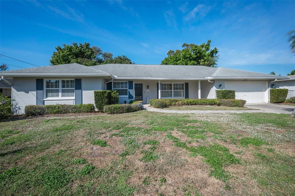 4 Hibiscus Road Belleair, FL 33756 - Photo 12 of 75 a front view of house with yard and green space