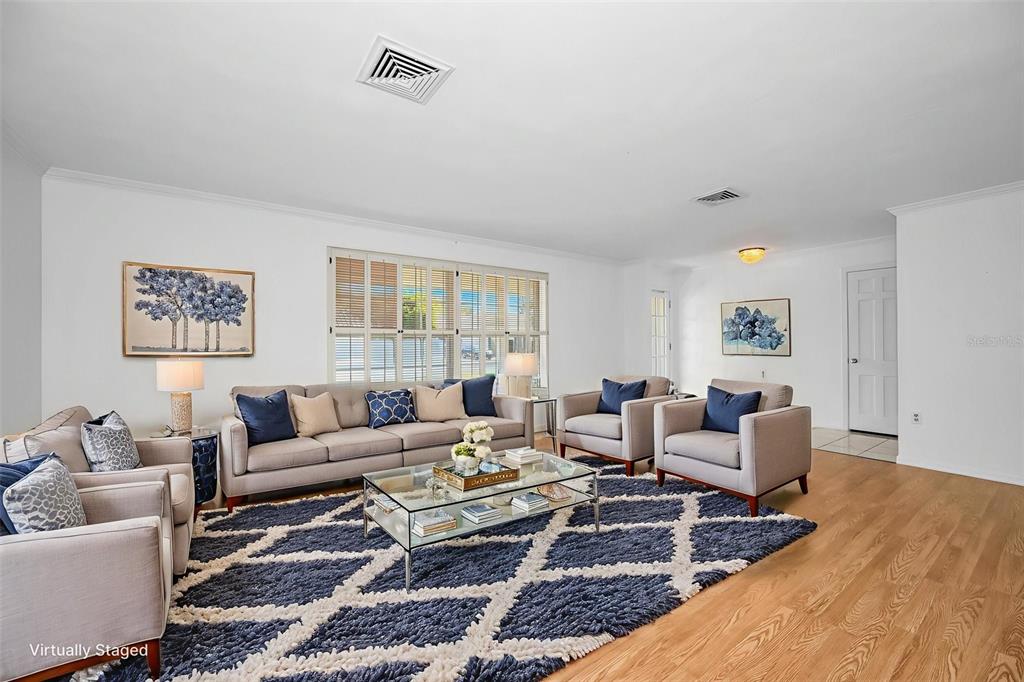 4 Hibiscus Road Belleair, FL 33756 - Photo 17 of 75 a living room with furniture wooden floor and window